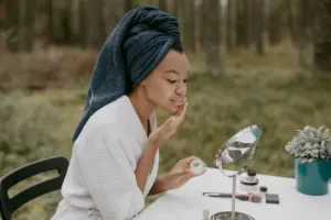 Skincare products and a soft towel on a counter